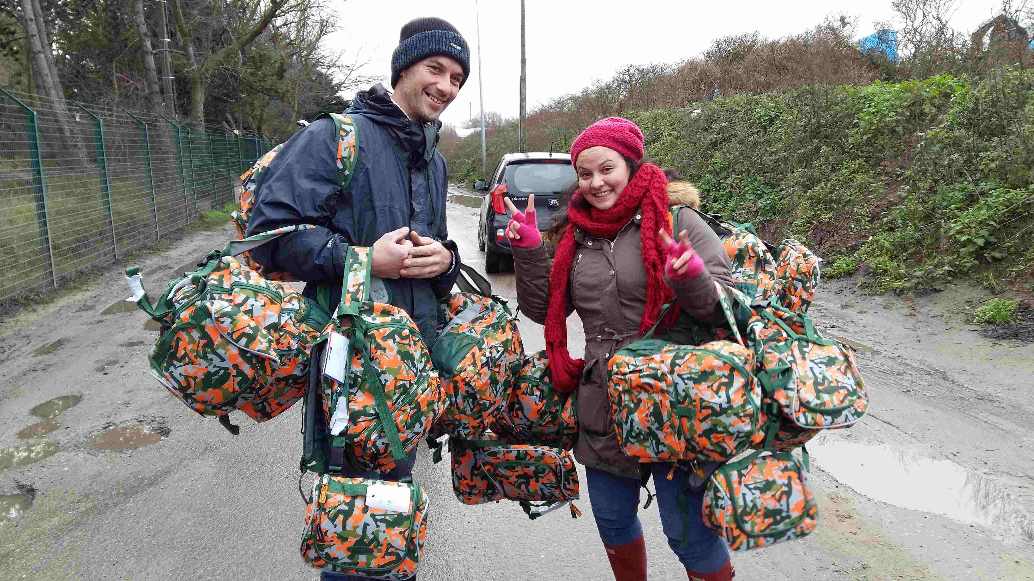 Wijnand
              and his wife collect the Christmas rucksacks to take to
              The Jungle for the children on Christmas Day