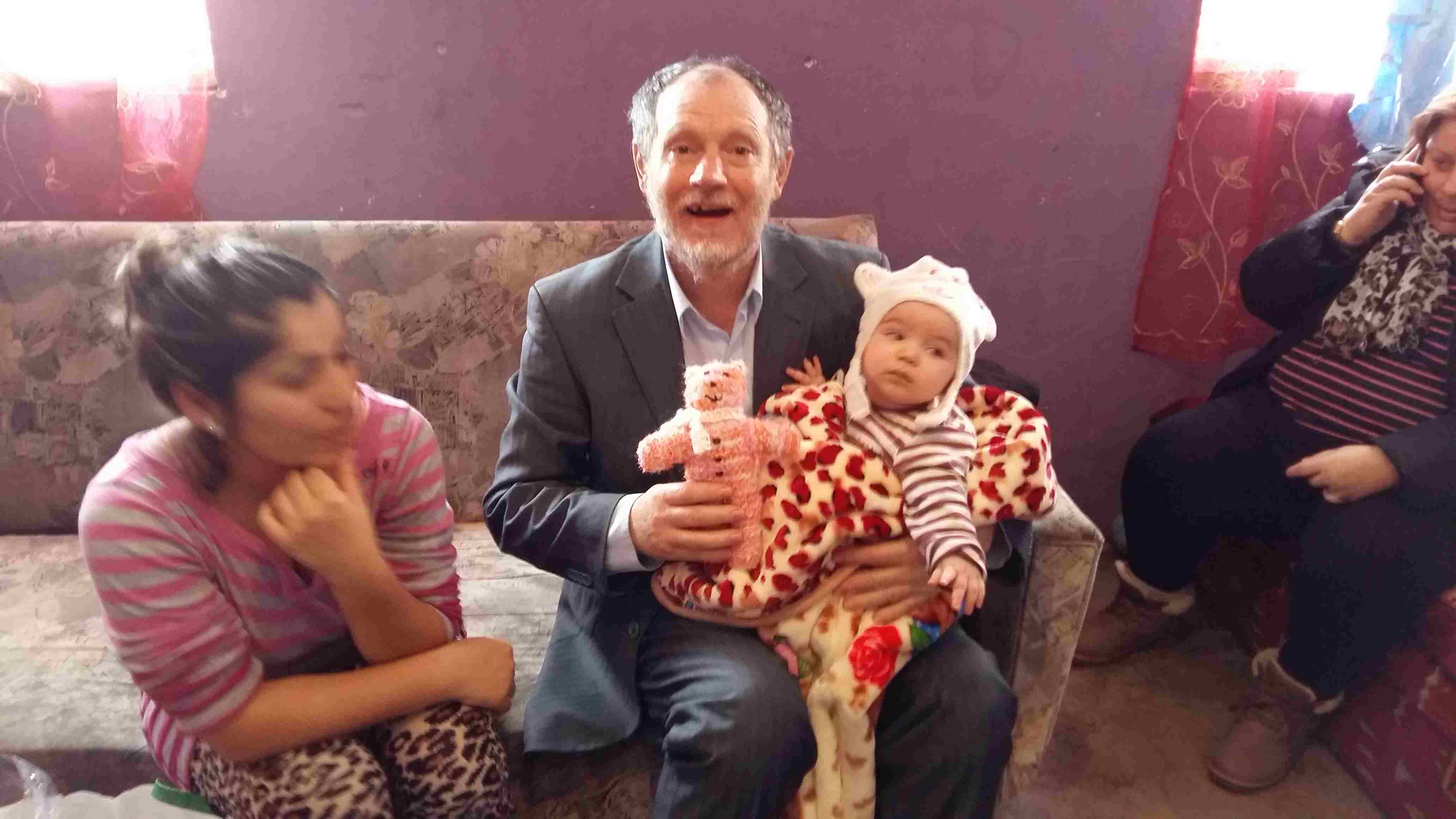 Pastor Lajos with Annmaries baby girl, Szofi