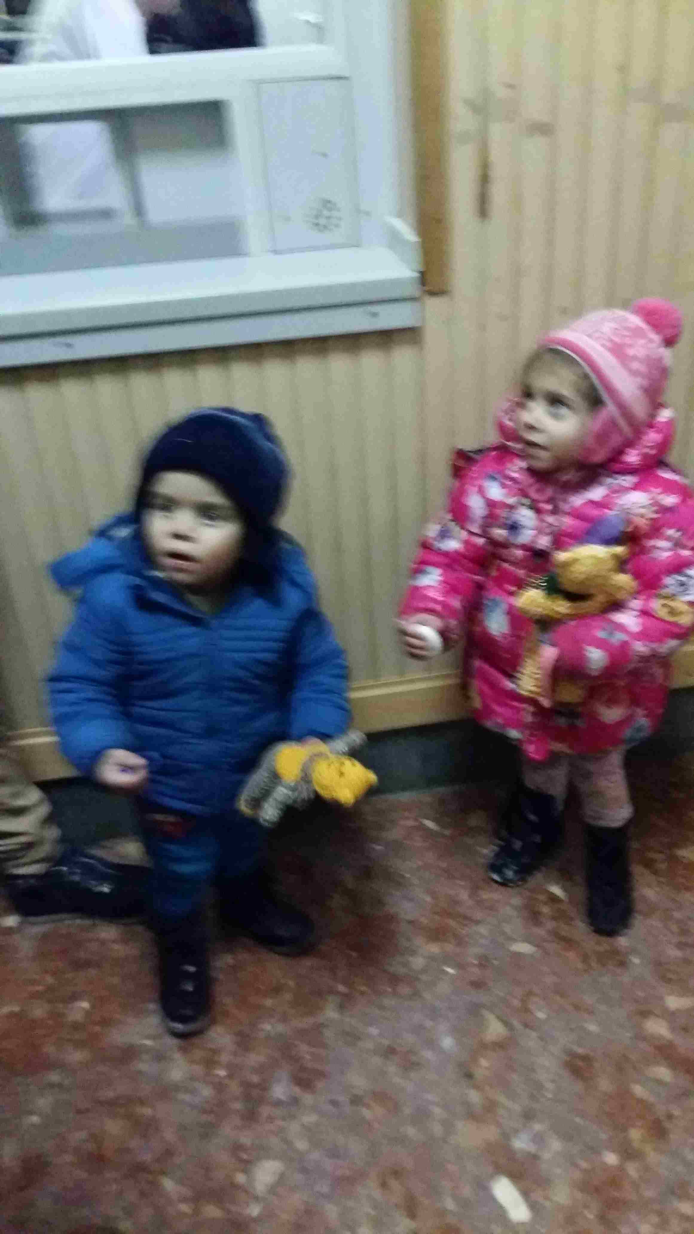 Children recieve toys at train station, in Vogygorky
