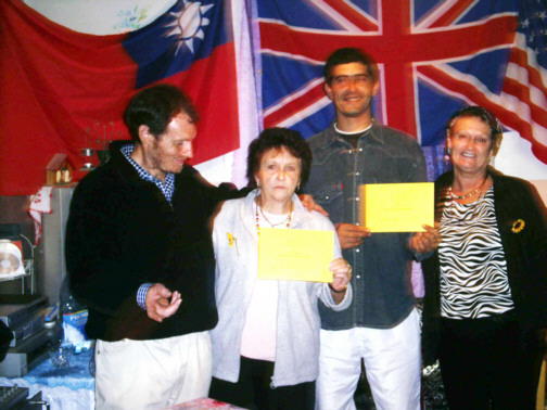 These are some of the village committe members,showing unity with the British flag in the back ground